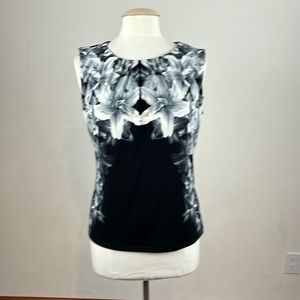 NWT! Calvin Klein, sleeveless black top with white floral design. size Medium